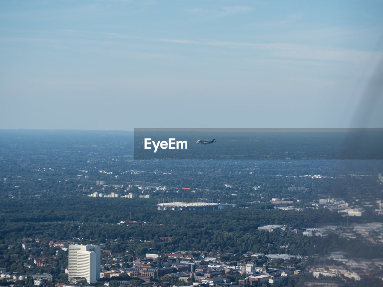 VIEW OF CITYSCAPE WITH SEA IN BACKGROUND