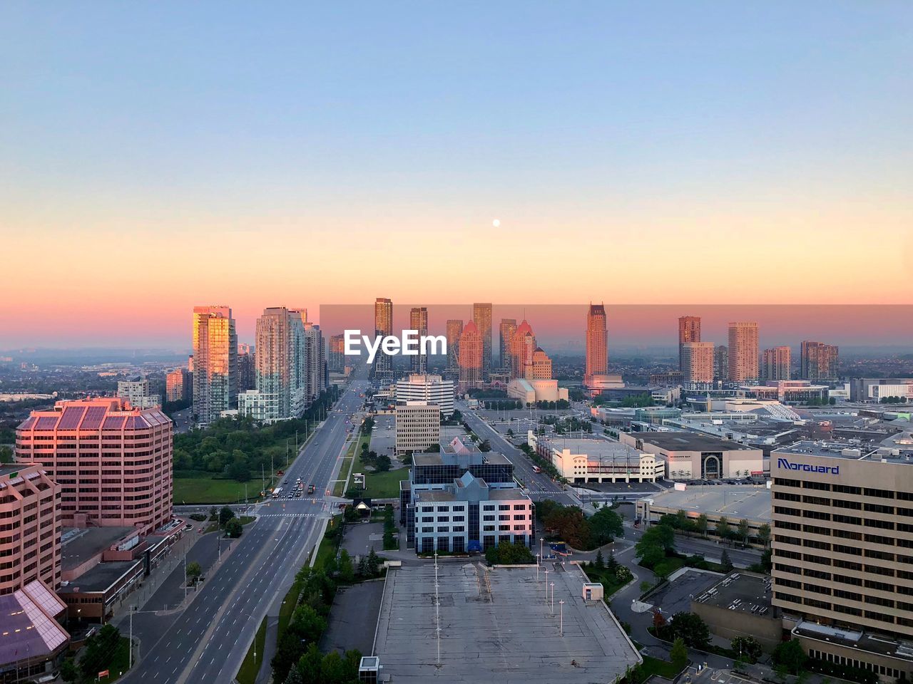 High angle view of city buildings during sunset