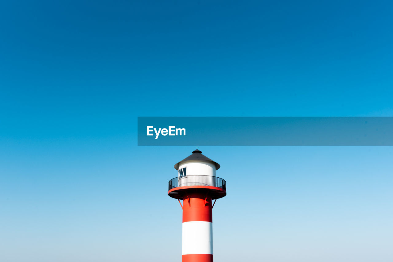 Low angle view of lighthouse against clear sky