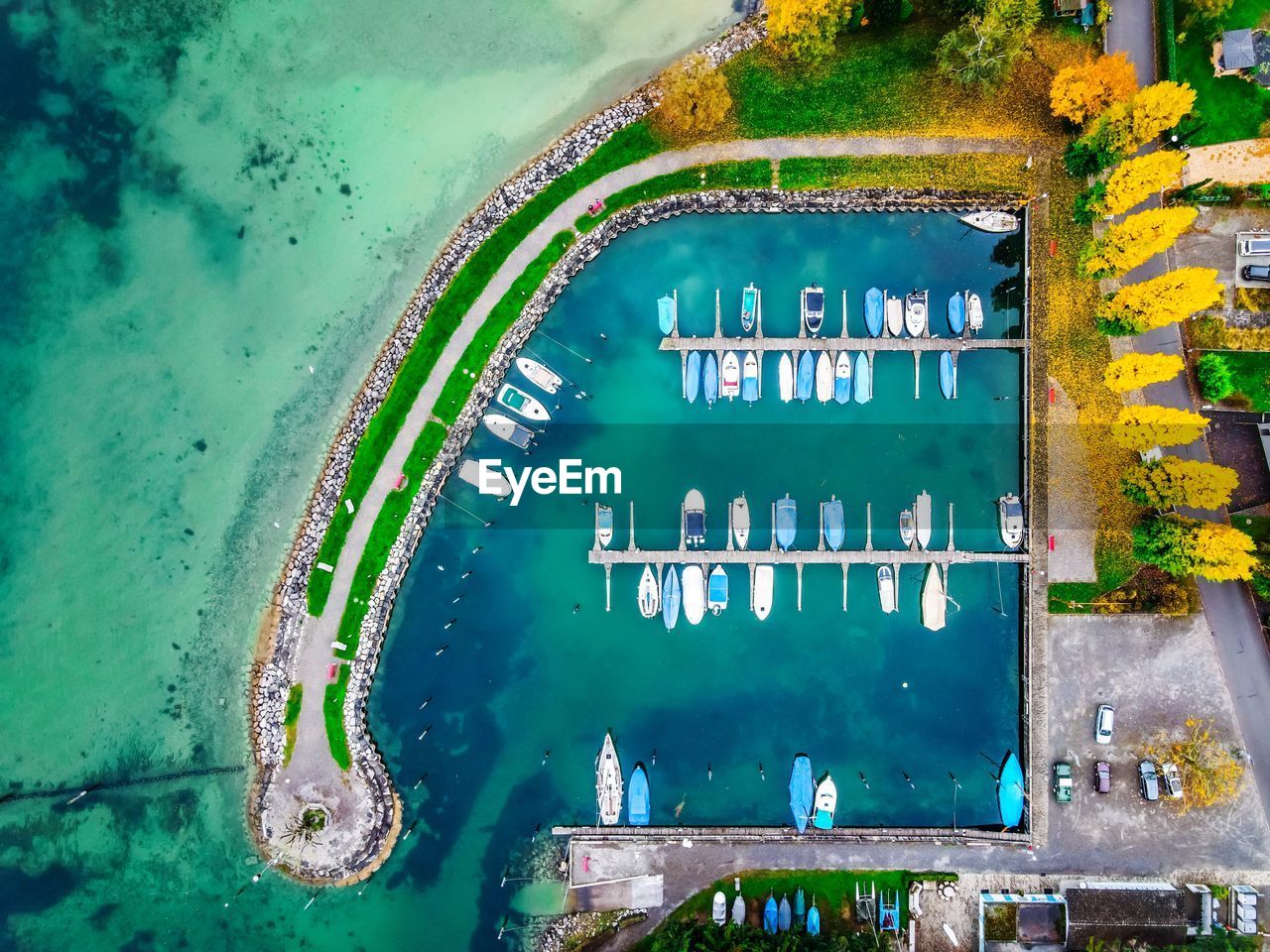 HIGH ANGLE VIEW OF SWIMMING POOL BY BUILDING