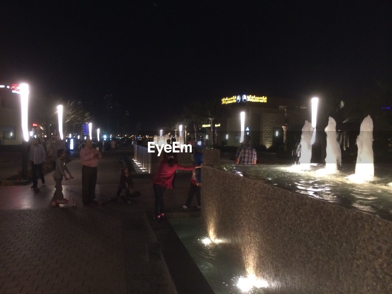 NIGHT VIEW OF ILLUMINATED STREET LIGHTS