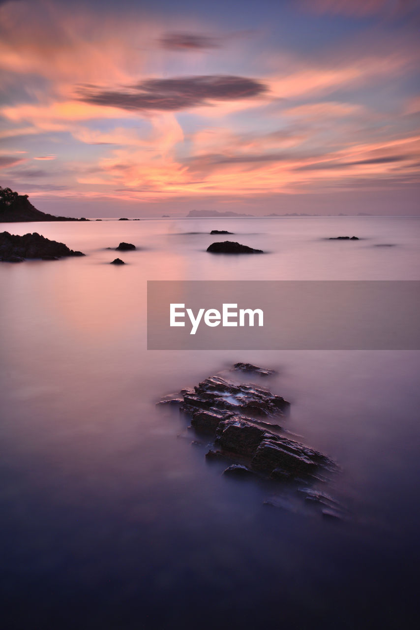 Scenic view of sea against sky during sunset