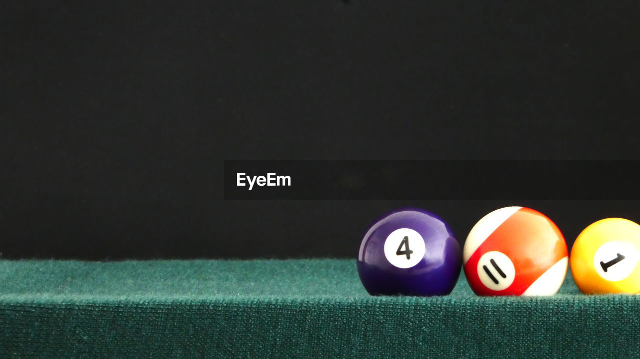 Close-up of pool balls on table