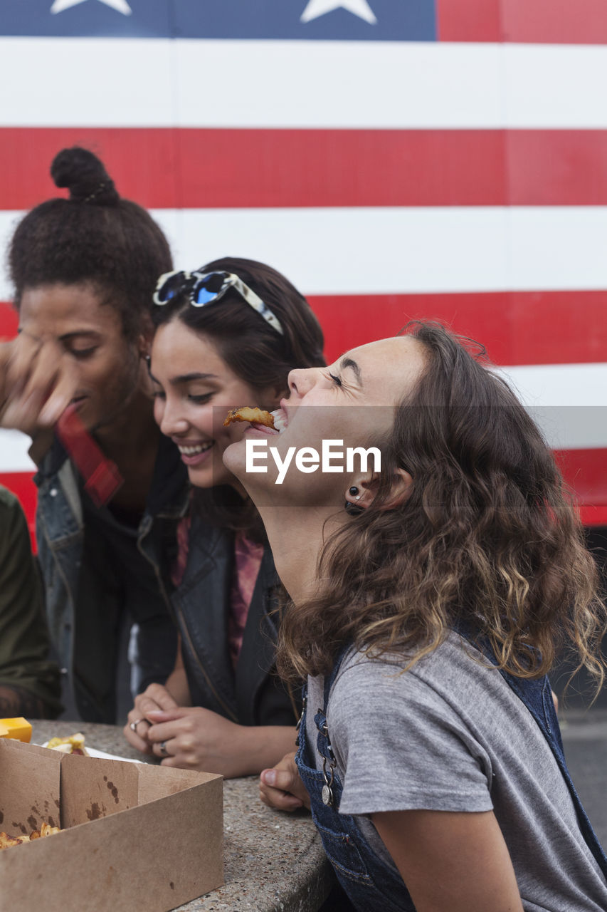 Friends enjoying fast food