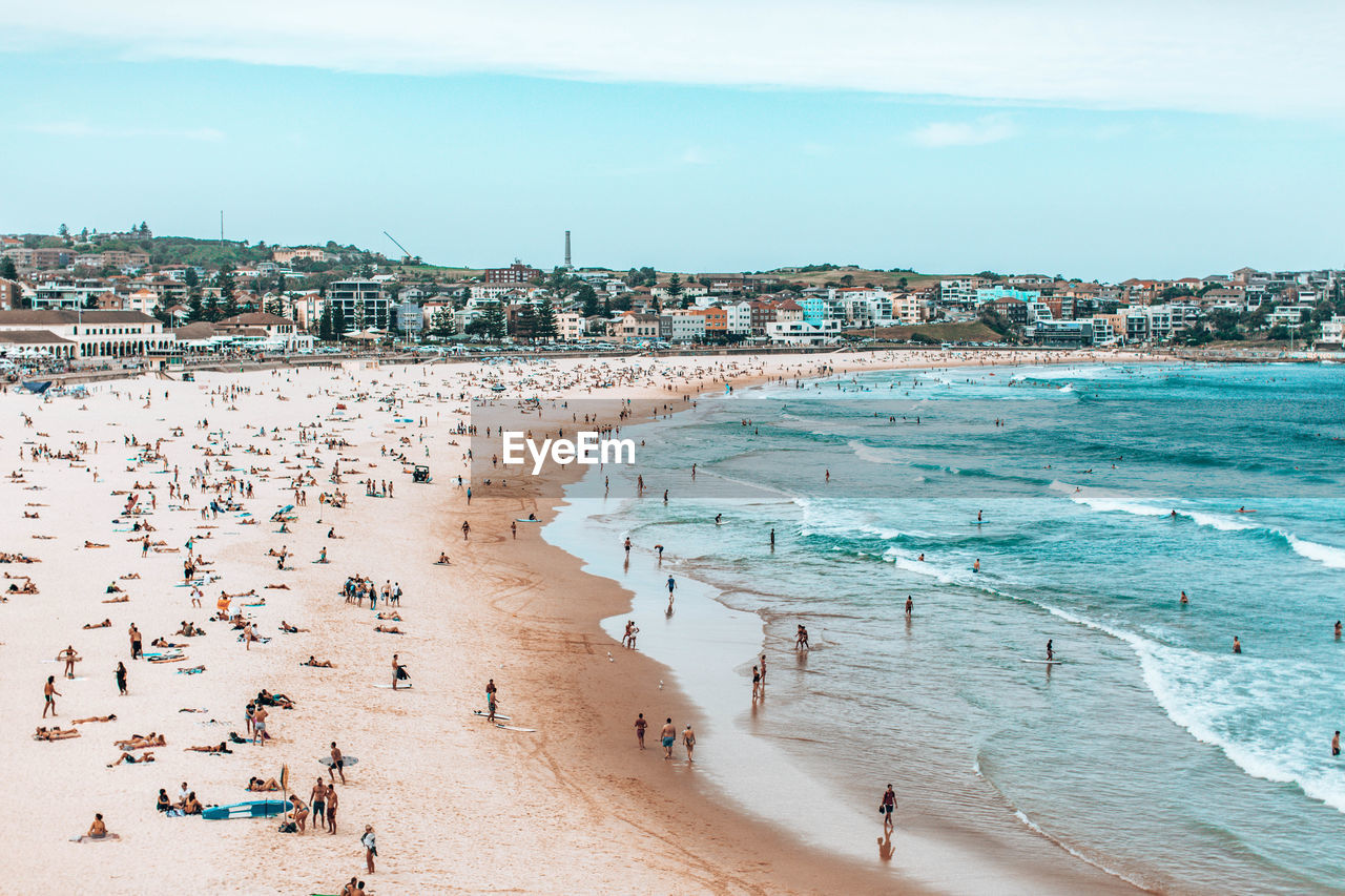 HIGH ANGLE VIEW OF PEOPLE AT BEACH