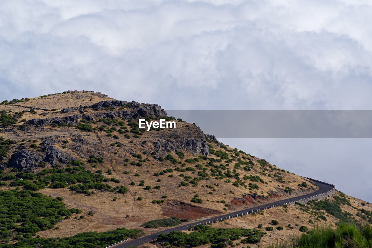 Scenic view of rocky mountains against sky