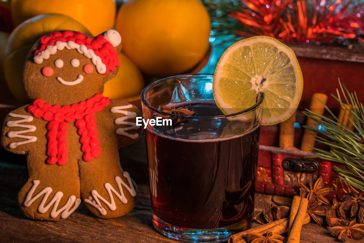 Close-up of drink and gingerbread cookie on table