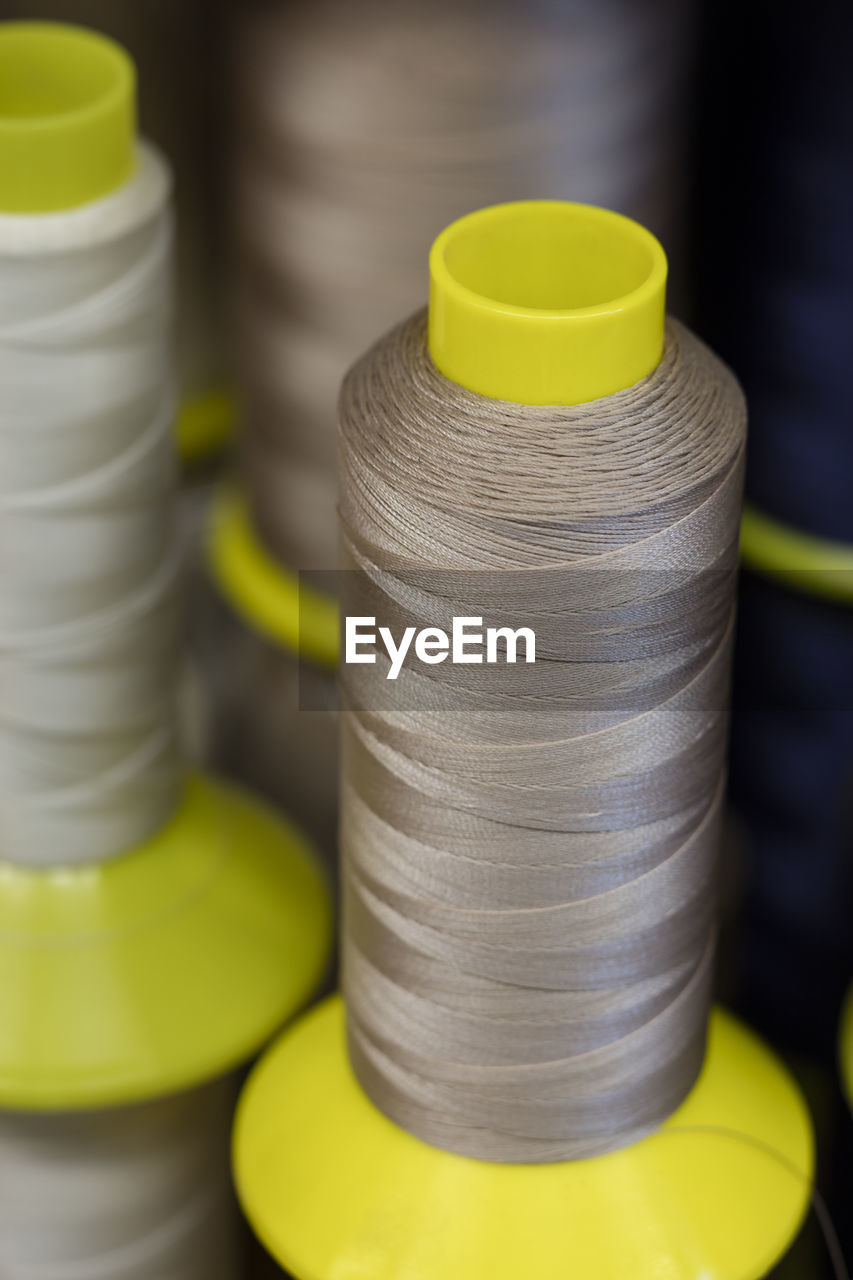 Close-up of gray thread spools