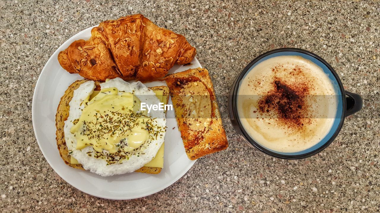 High angle view of food by coffee on table