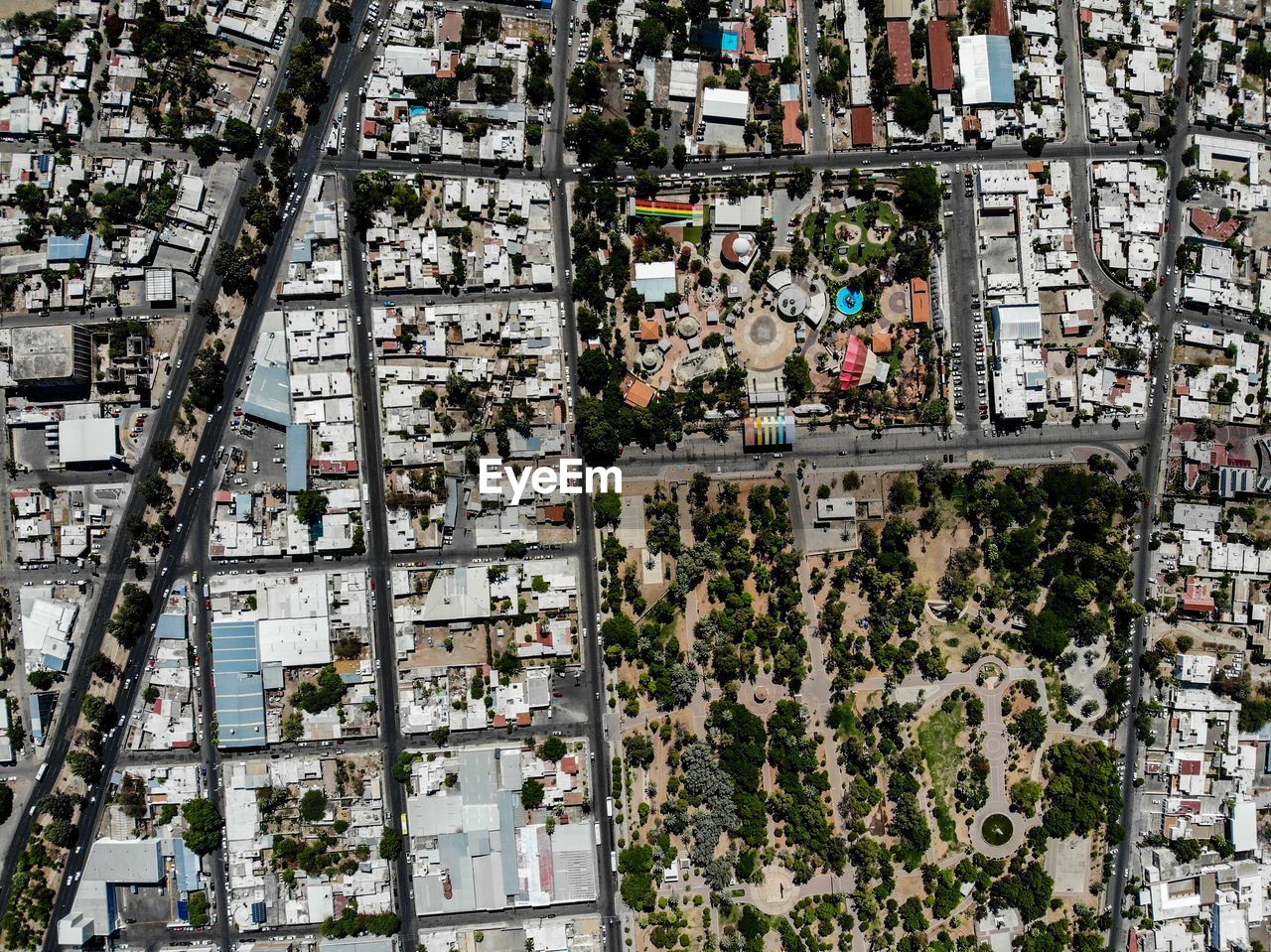 High angle view of trees and buildings in city