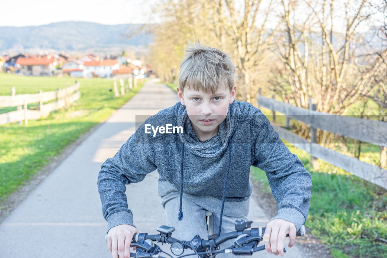 Portrait of boy riding bicycle
