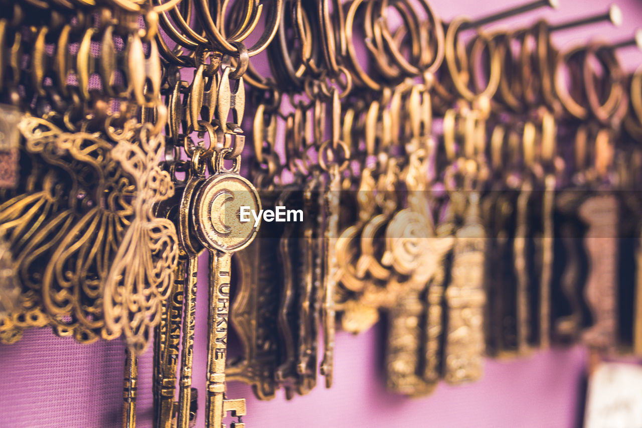 Close-up of keys hanging on wall for sale