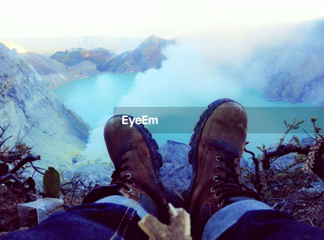 Avid nature lover watching hot spring valley in wilds