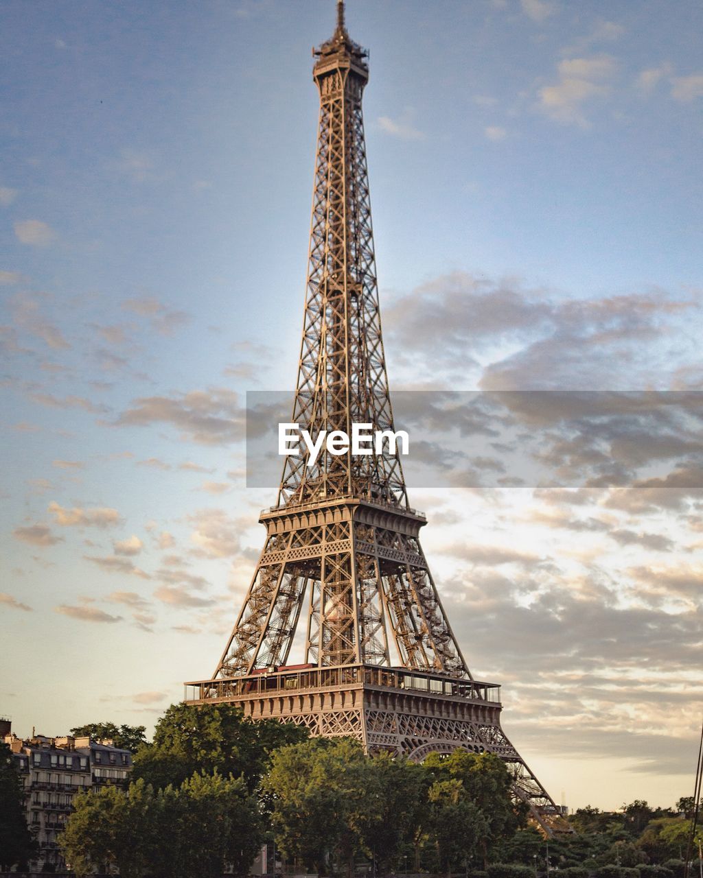 Low angle view of eiffel tower against sky during sunset