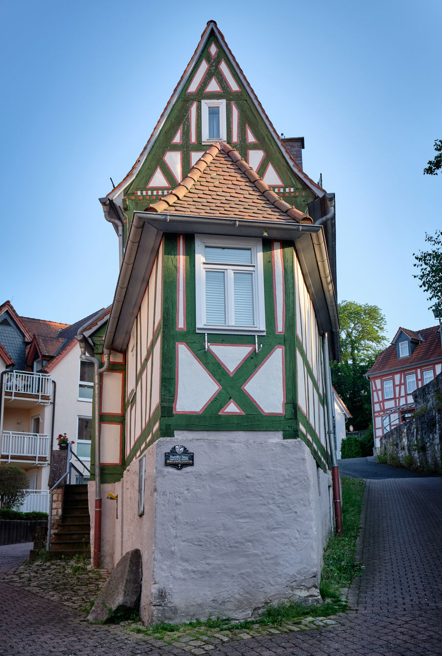 HOUSES AGAINST SKY