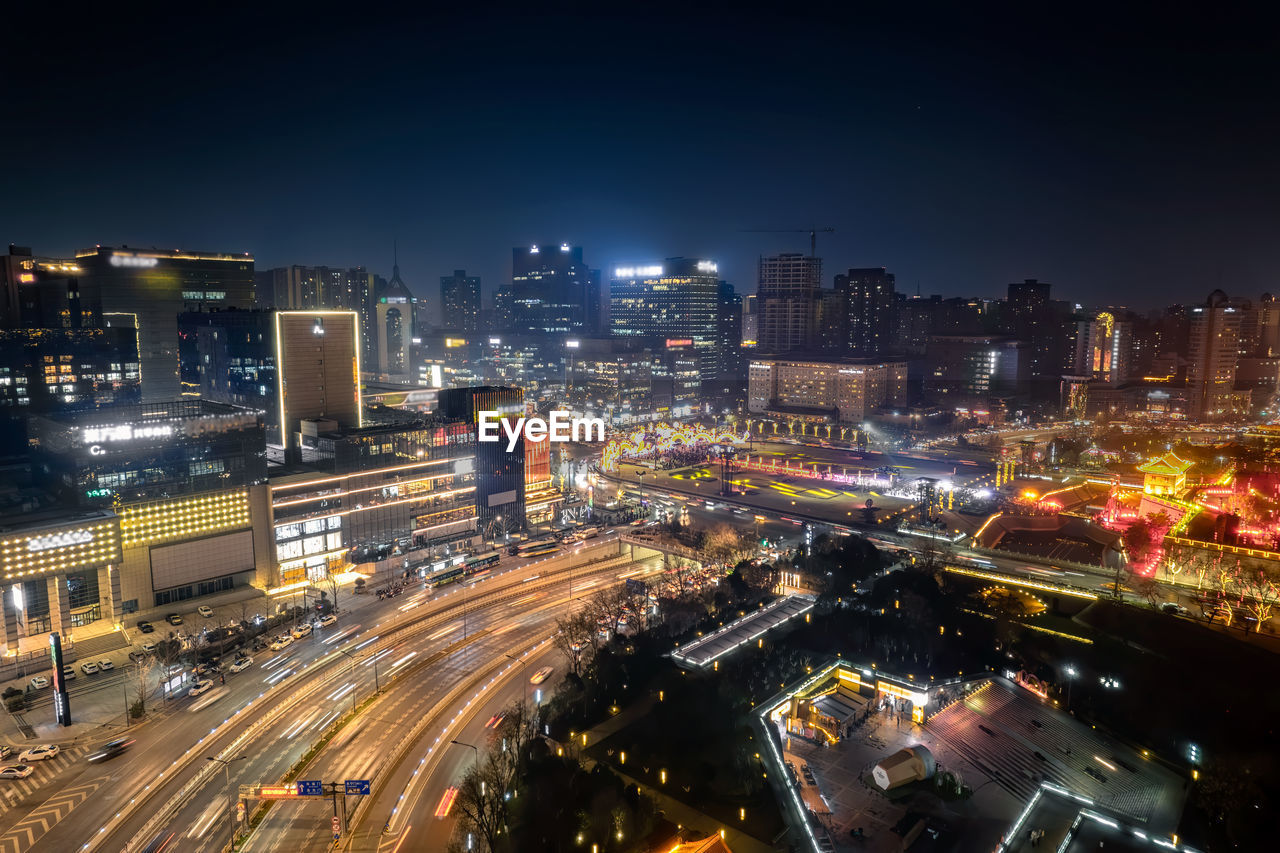 High angle view of illuminated city at night