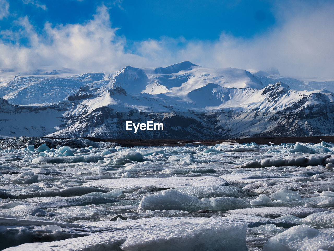 Scenic view of snowcapped mountains against sky