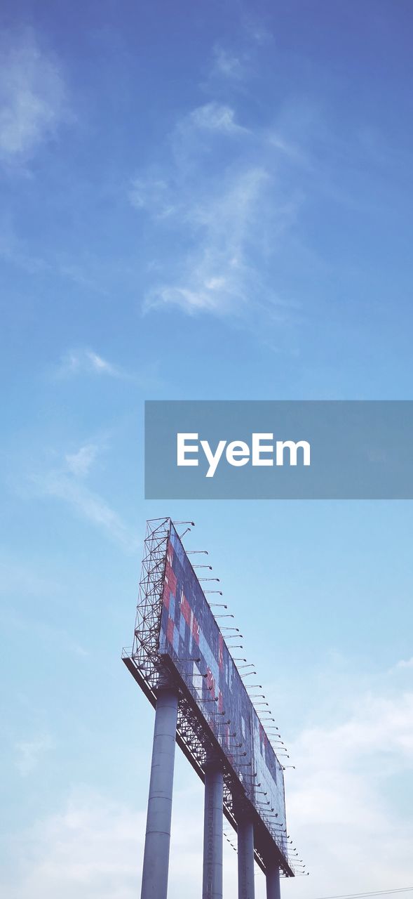 LOW ANGLE VIEW OF COMMUNICATIONS TOWER AGAINST SKY