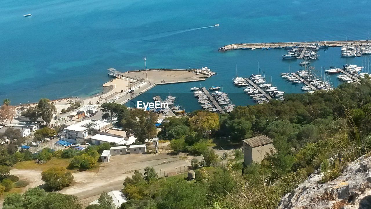 HIGH ANGLE VIEW OF HARBOR BY CITY