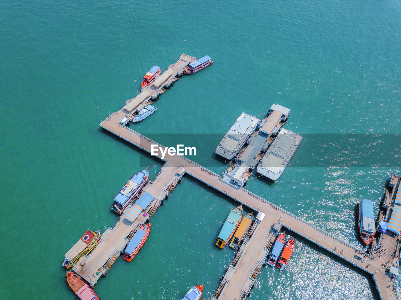 HIGH ANGLE VIEW OF COMMERCIAL DOCK AND SEA