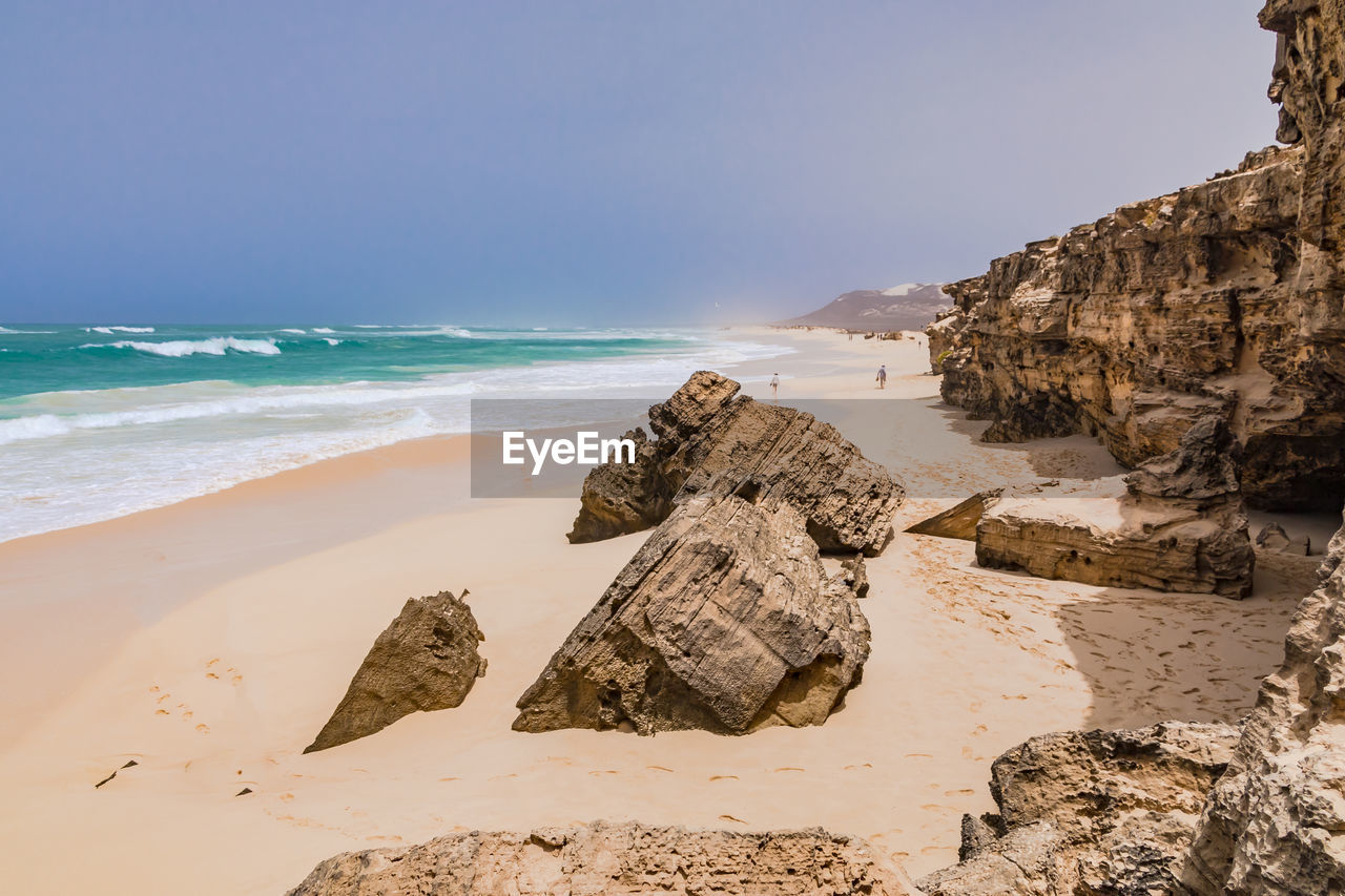 Picturesque rocks on the beach of varandinha on the vacation island of boa vista, cape verde