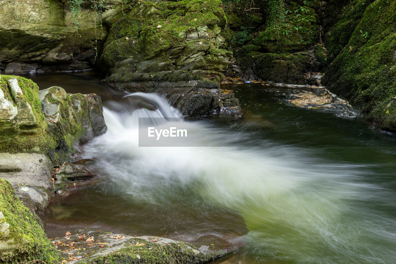 SCENIC VIEW OF WATERFALL