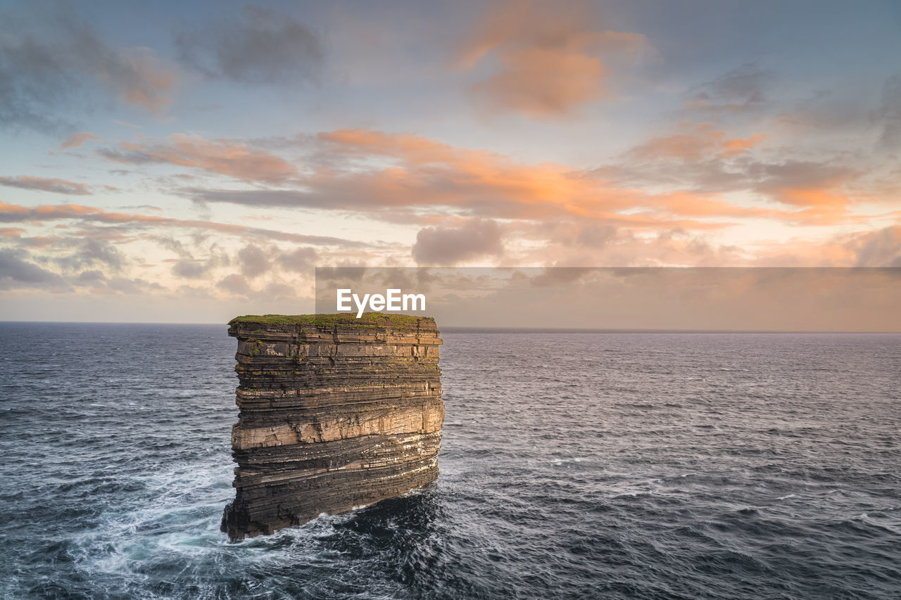 Sea stack downpatrick head standing in atlantic ocean, ireland