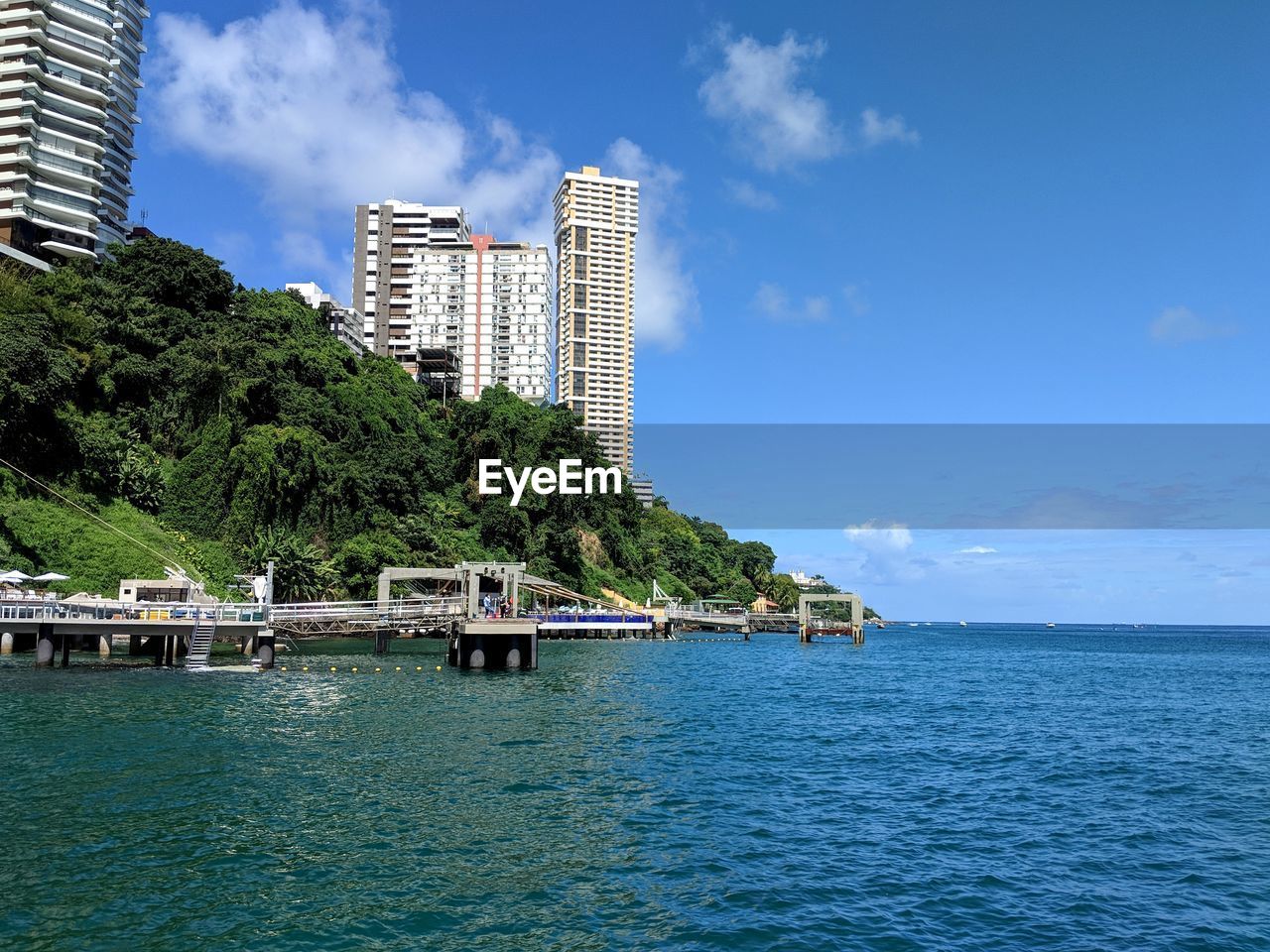SCENIC VIEW OF SEA AGAINST BUILDINGS