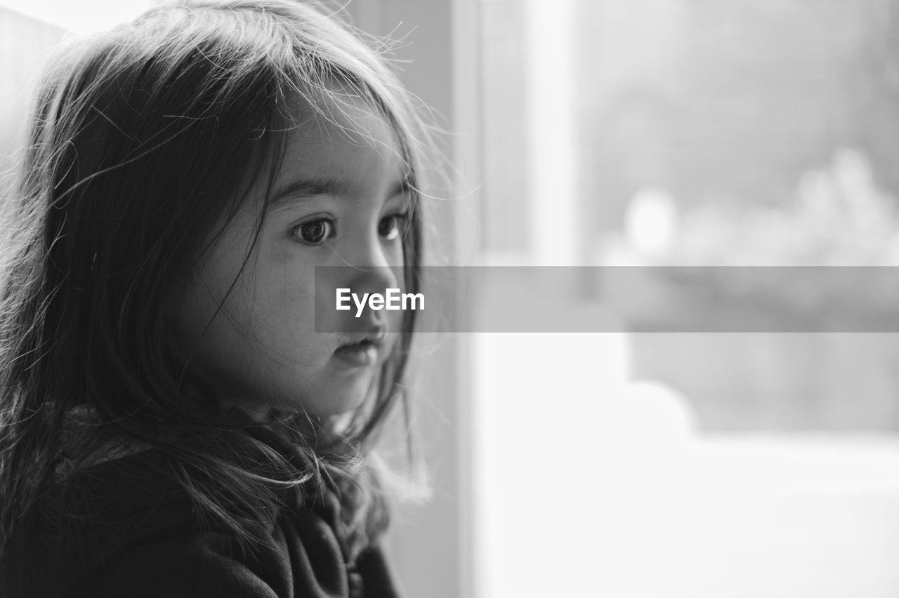 CLOSE-UP PORTRAIT OF CUTE GIRL AT HOME