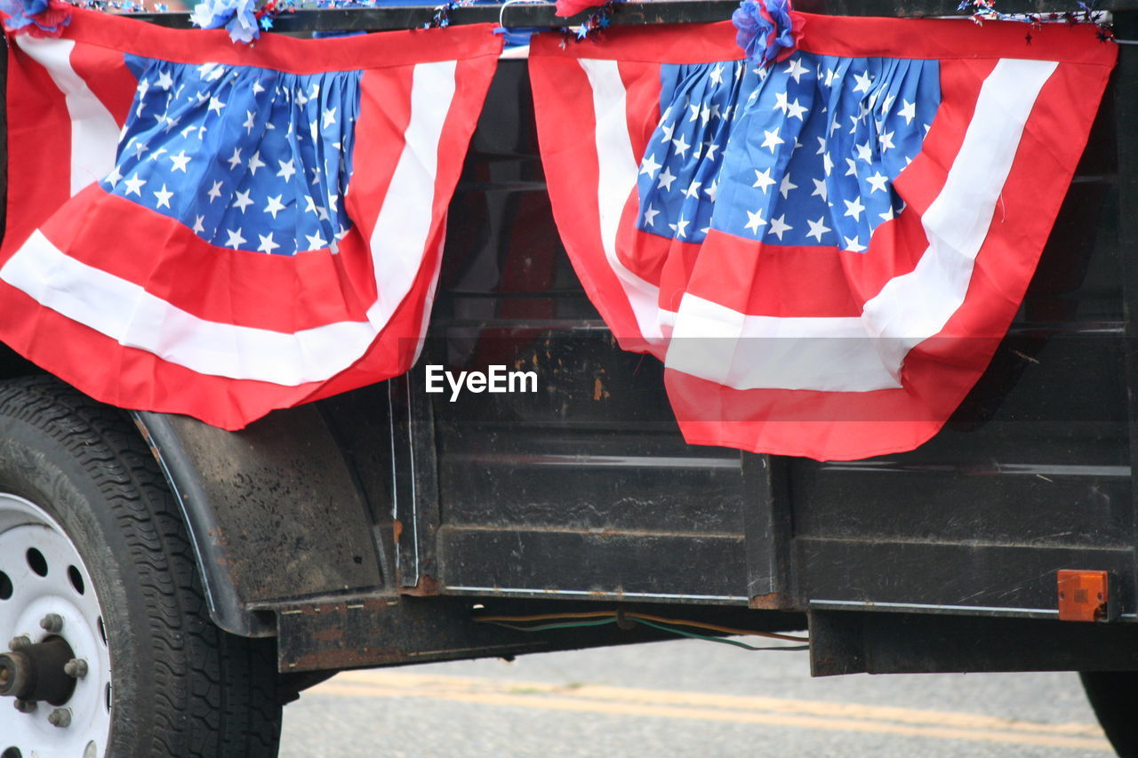 American flag on vehicle trailer during independence day parade