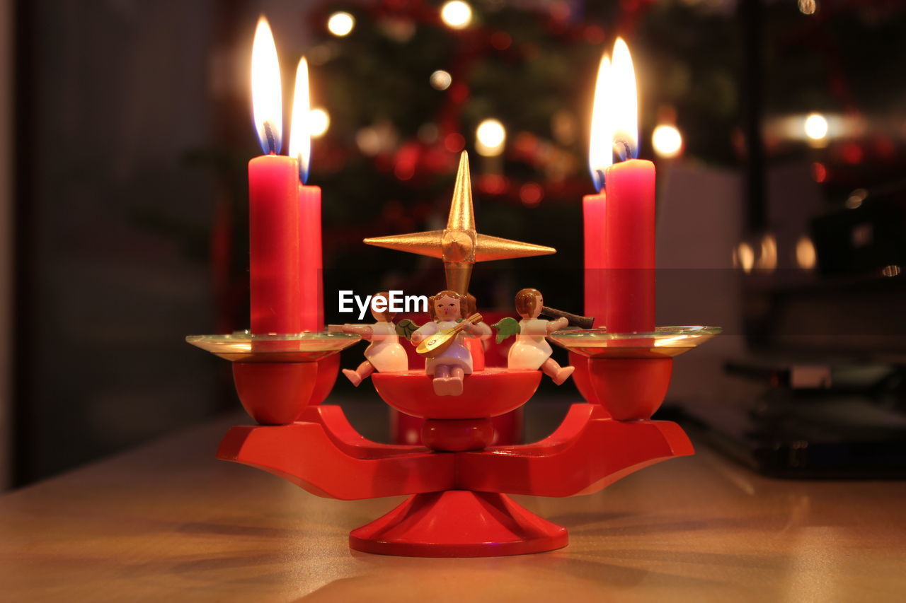 Close-up of tea light candles on table