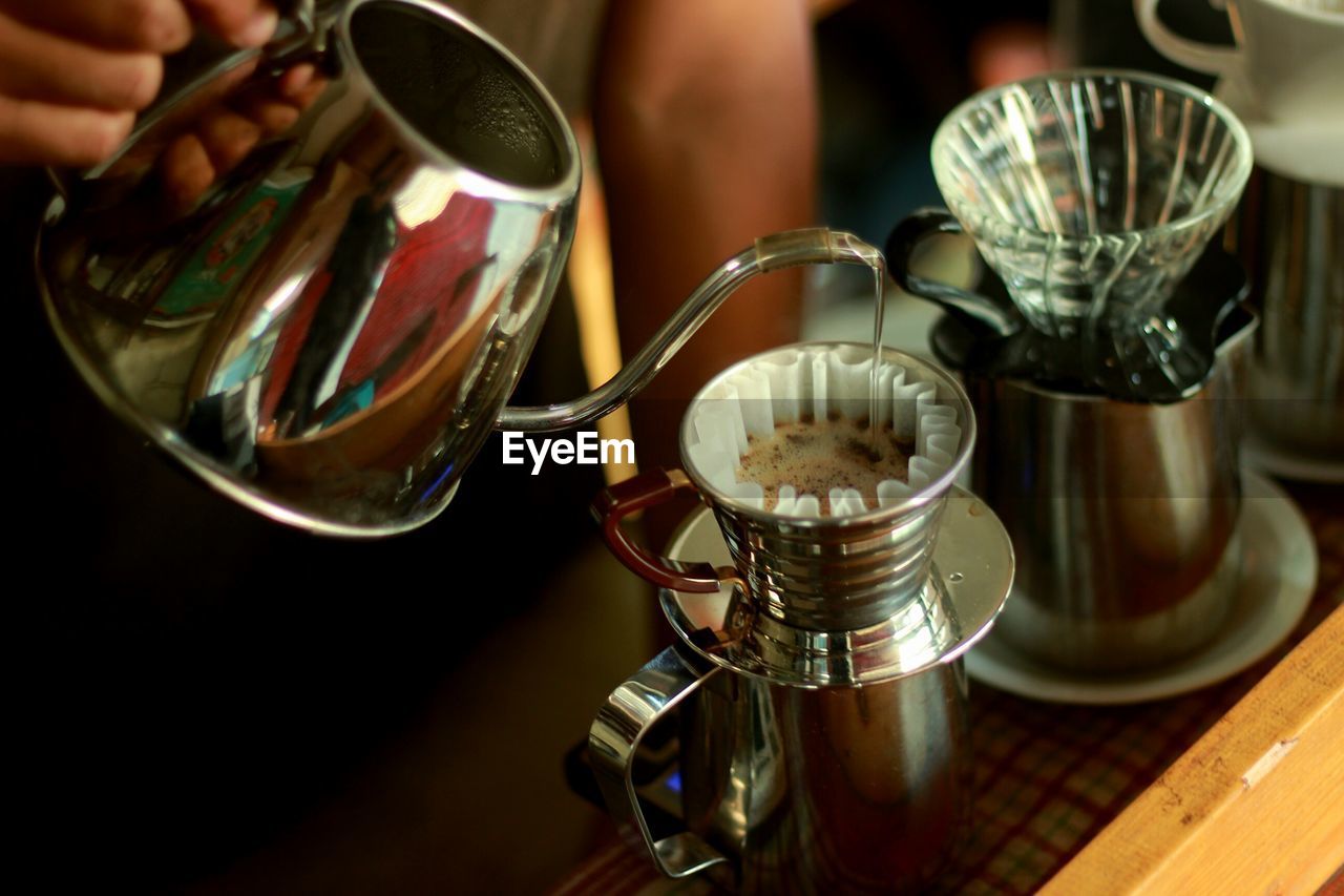 CLOSE-UP OF COFFEE CUPS ON TABLE