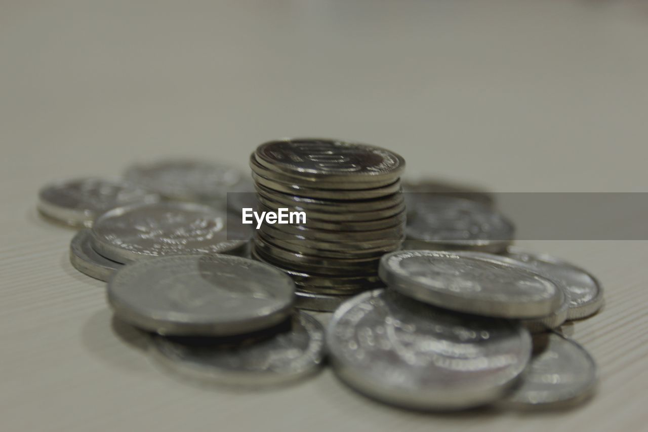 Close-up of coins on table