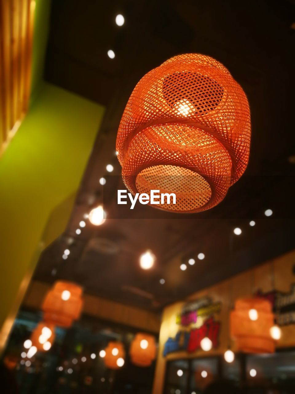 Low angle view of illuminated lantern in restaurant