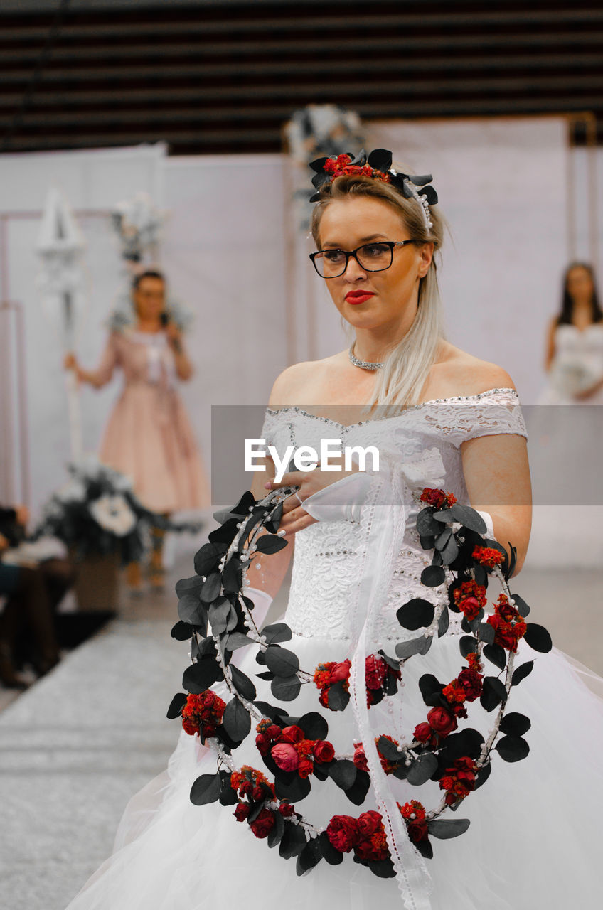 Bride holding wreath