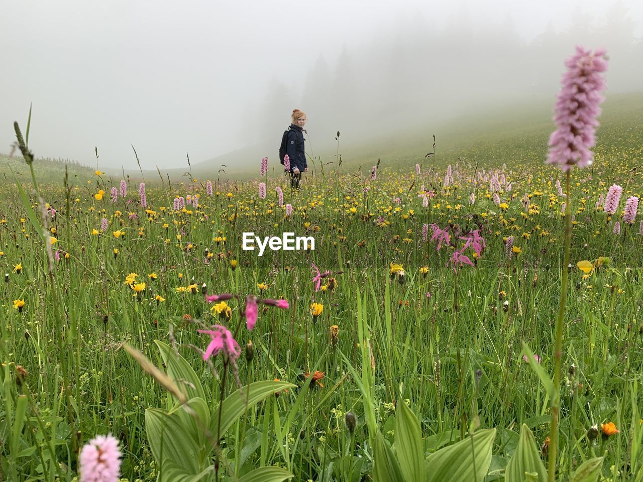 PERSON WALKING ON FIELD