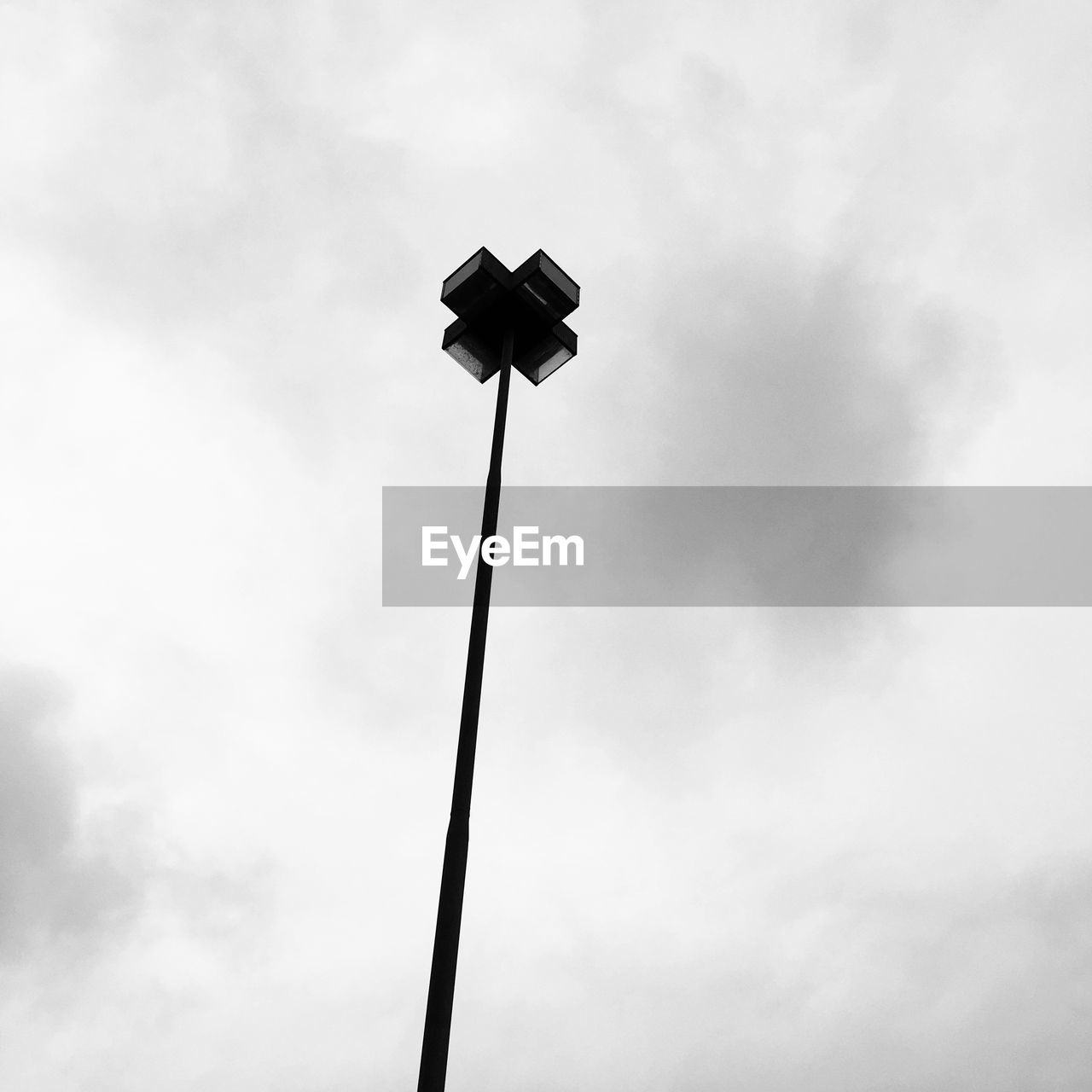 LOW ANGLE VIEW OF FLOODLIGHT AGAINST SKY