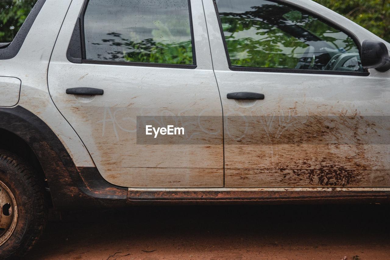 Close-up of dirty car outdoors