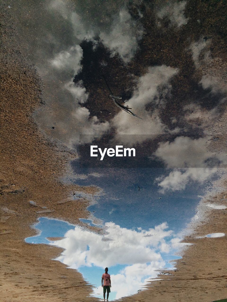 Man reflection in puddle