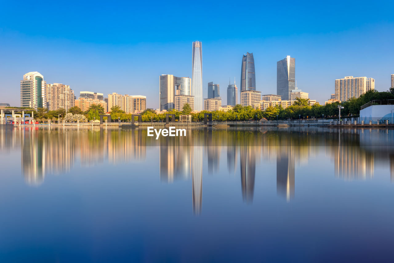 Reflection of buildings in lake water