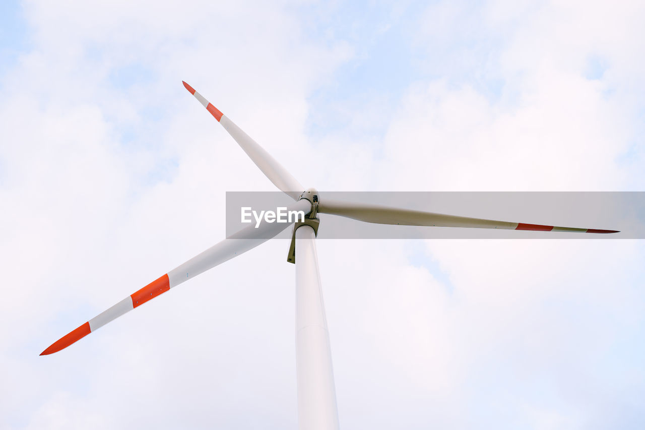 Low angle view of wind turbine against sky