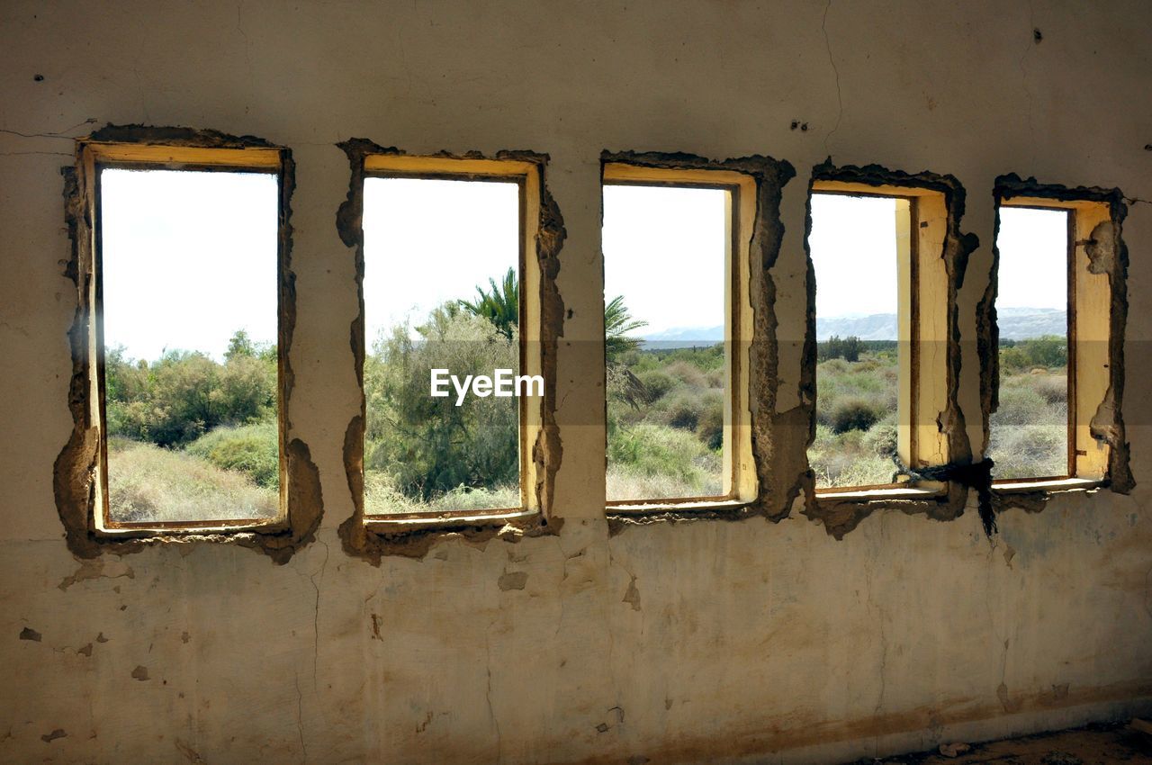 CLOSE-UP OF WINDOW AGAINST THE SKY