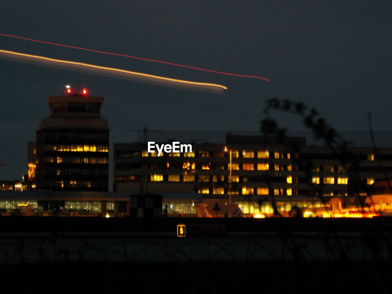 VIEW OF ILLUMINATED BUILDINGS AT NIGHT