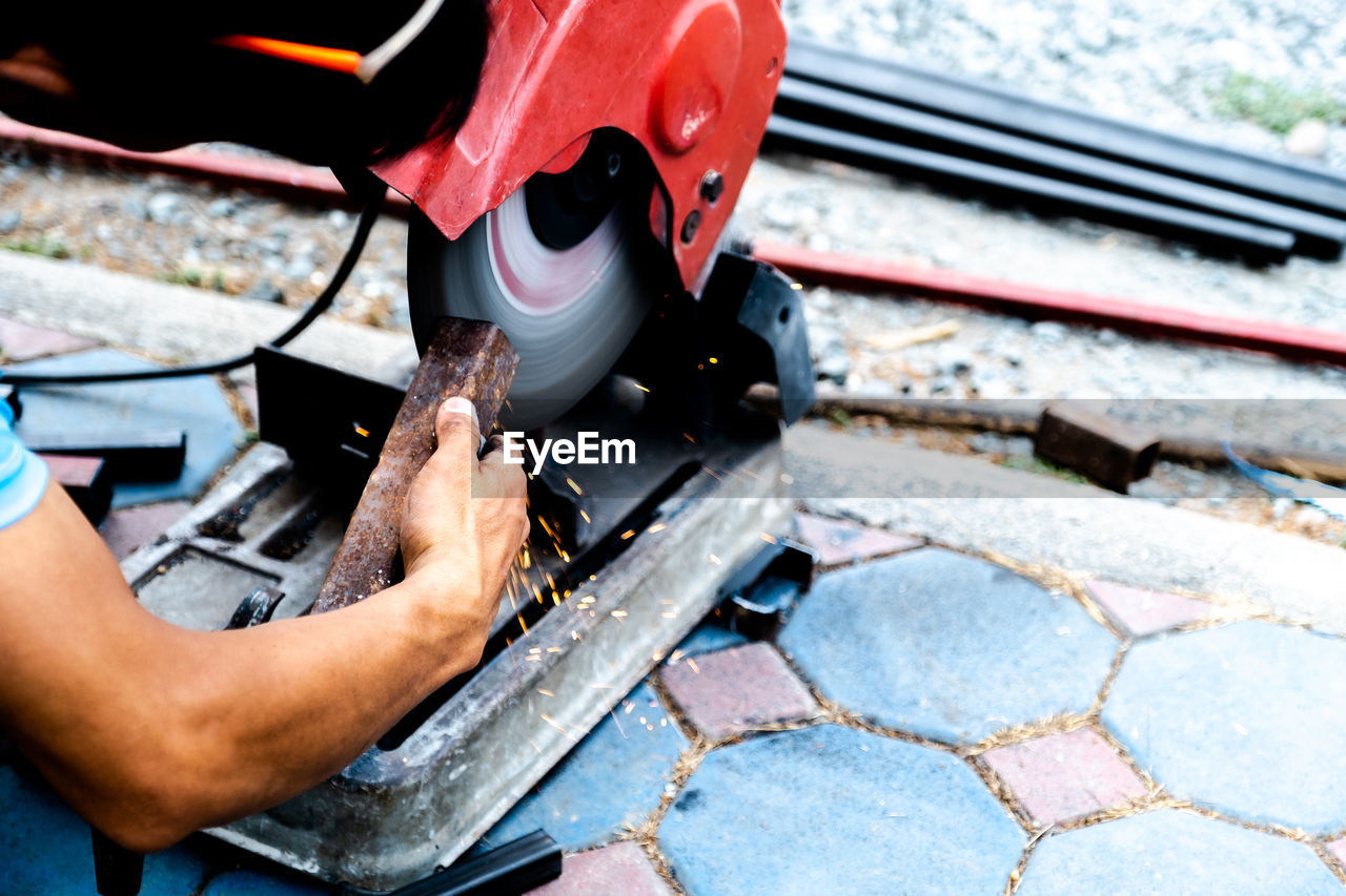 High angle view of man working on motorcycle