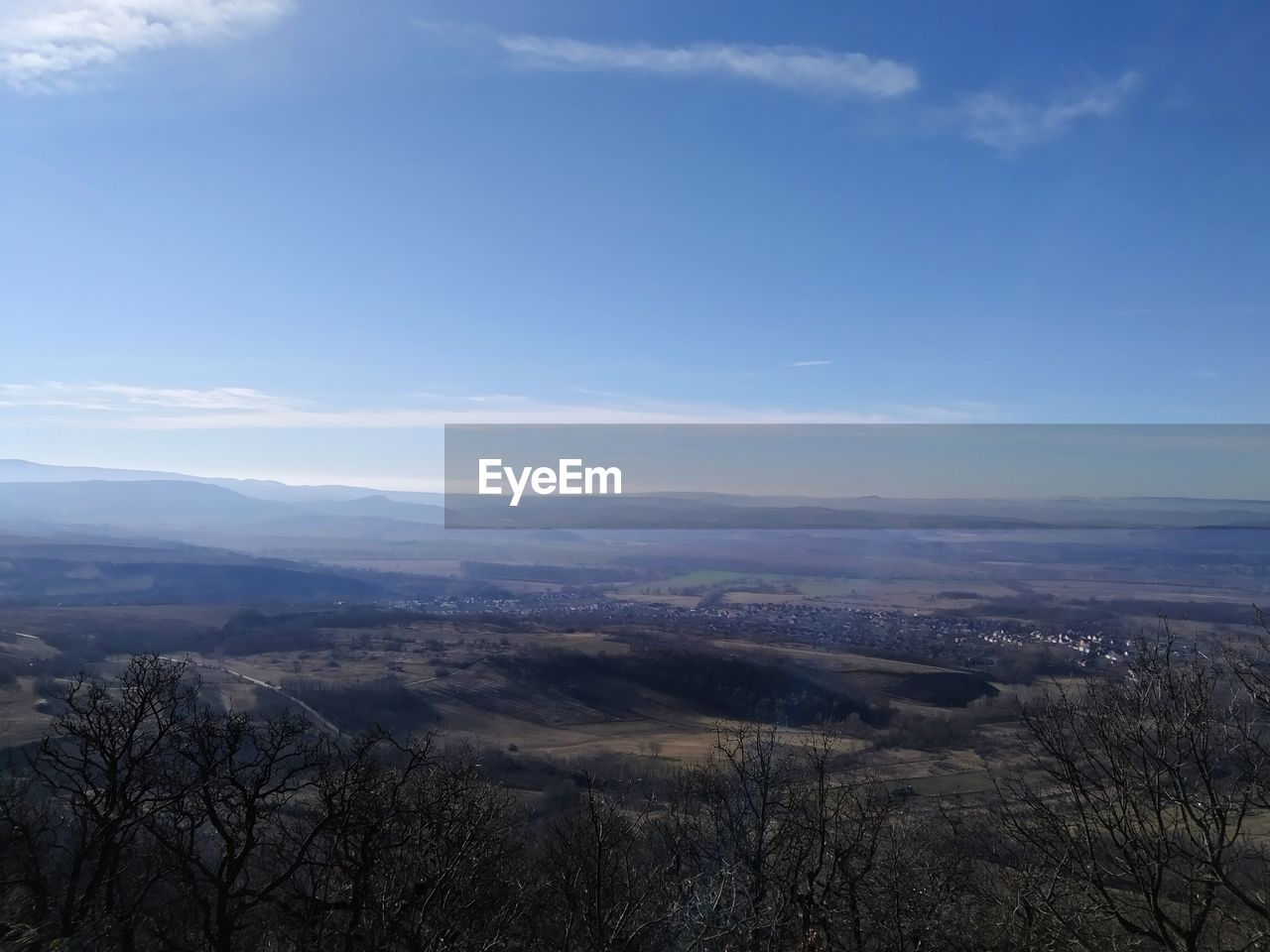 AERIAL VIEW OF LANDSCAPE AGAINST BLUE SKY