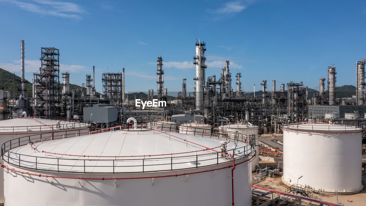 Oil and gas refinery petrochemical plant industrial with oil and gas storage tank, white oil and gas