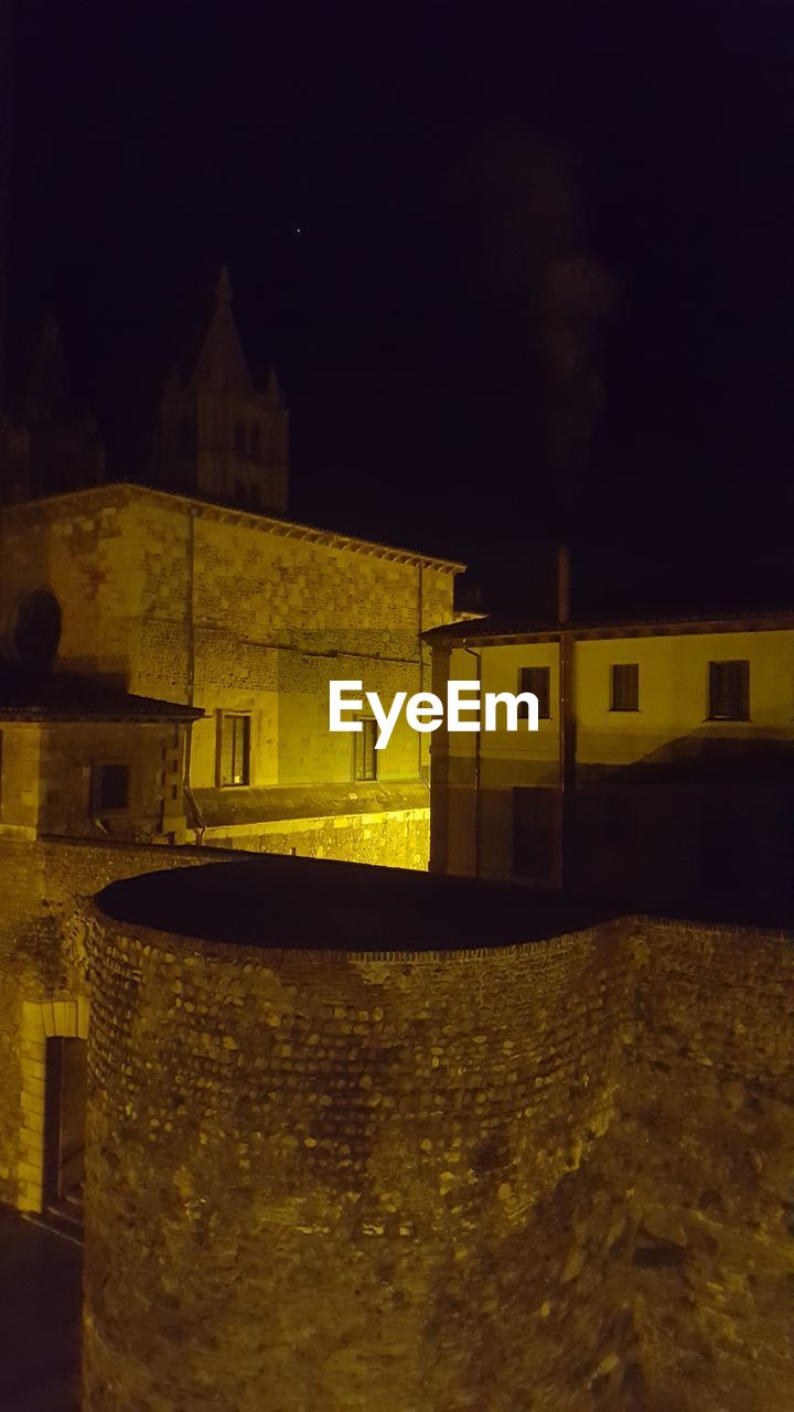 ILLUMINATED BUILDING AT NIGHT