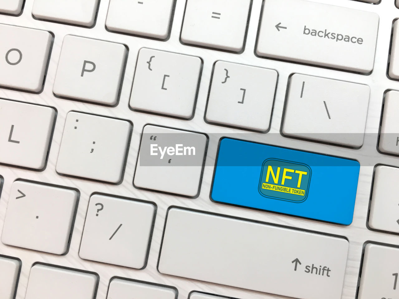 Computer keyboard enter button with nft symbol. non fungible tokens concept
