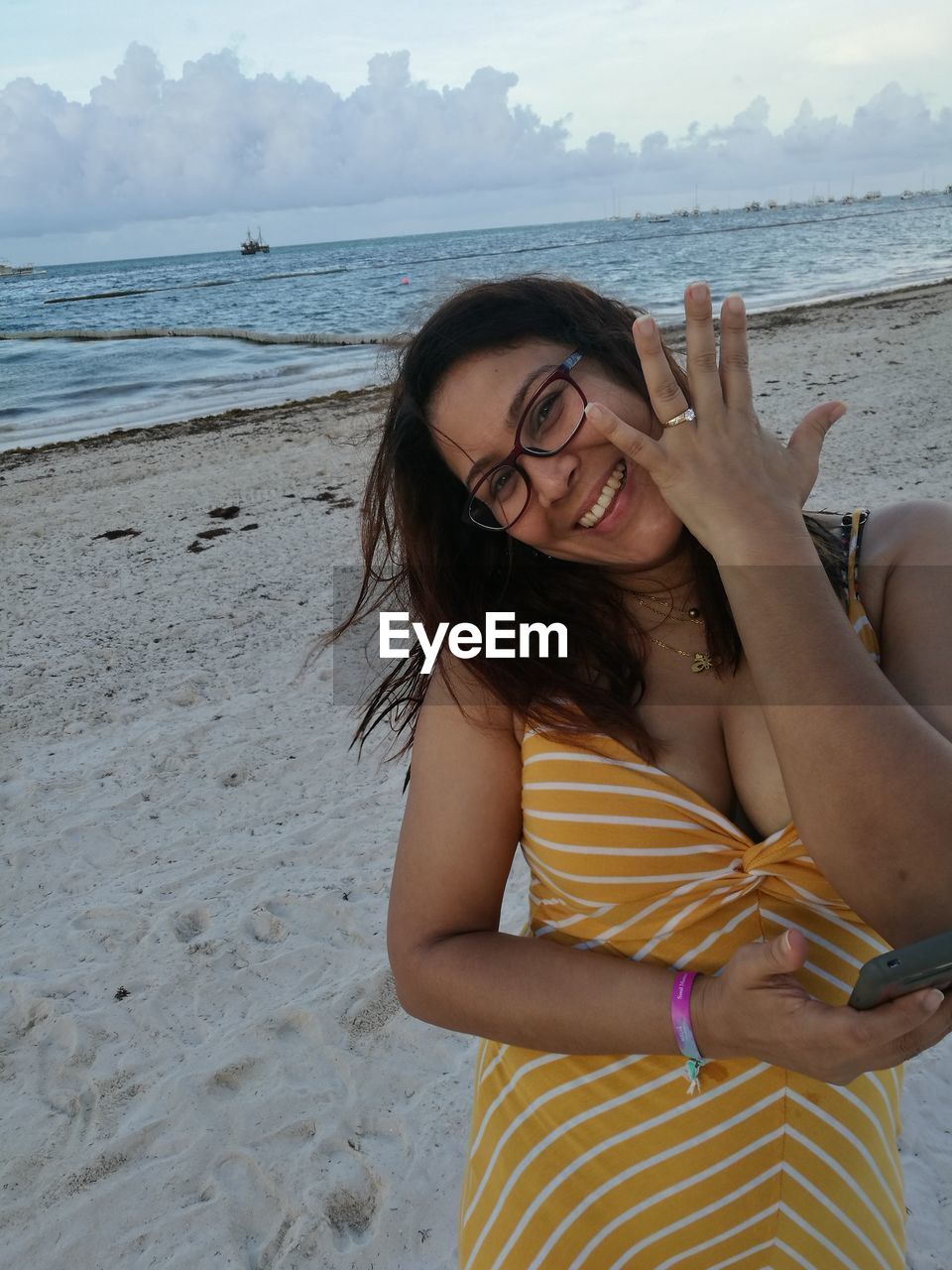 Portrait of woman showing ring