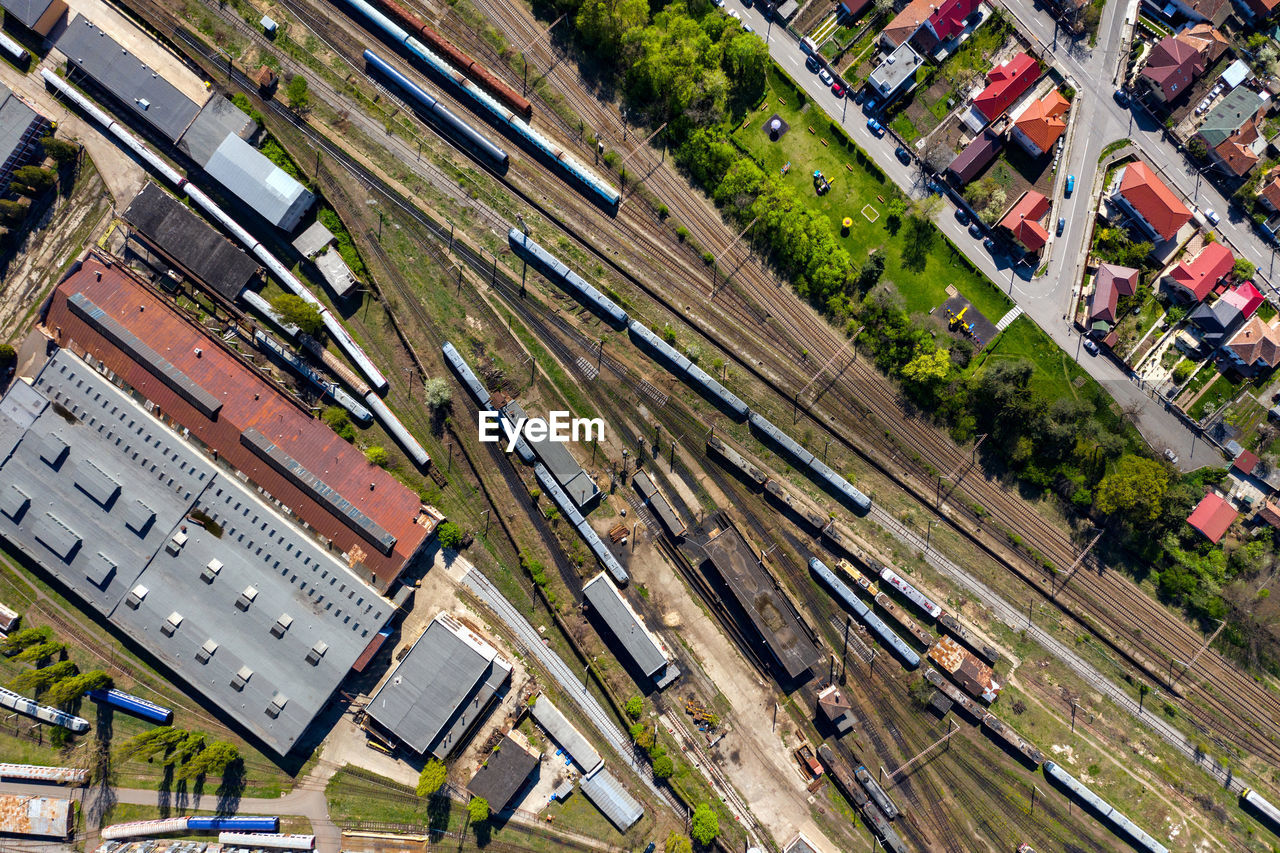 Aerial drone view of old locomotive train depo, parking iron horses on railway routes. diesel engine